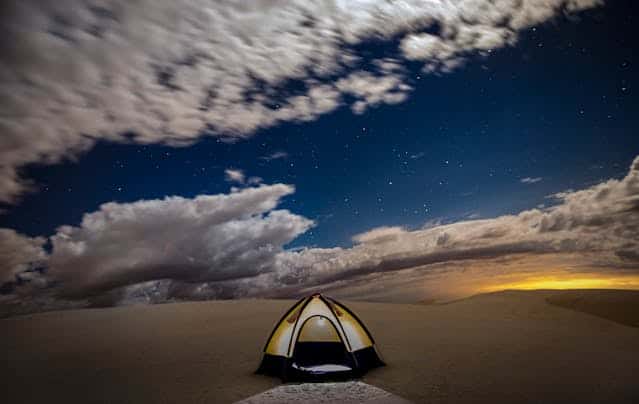 Tent in desert after dusk