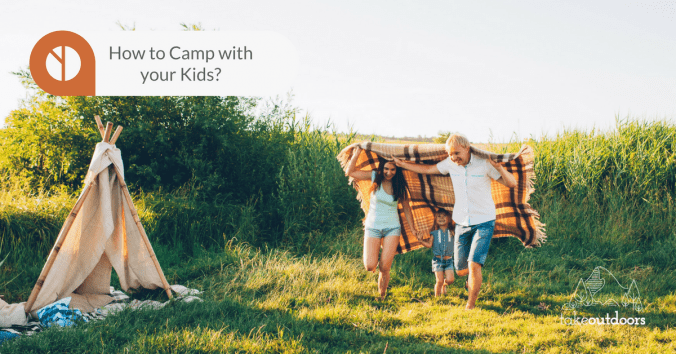 Photo of a family on a camping trip happily running around